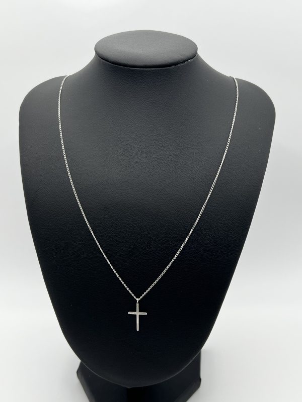 Very delicate silver chain with delicate cross pendant