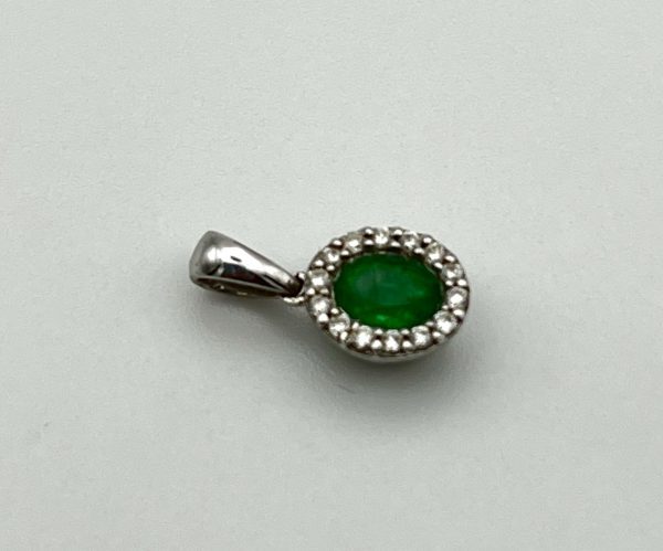 An emerald and diamond 18ct white gold pendant