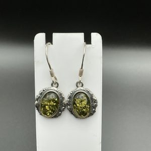 Natural green amber drop earrings encased in Silver