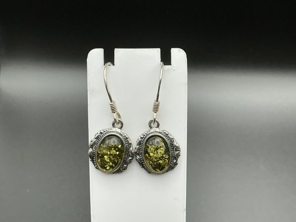 Natural green amber drop earrings encased in Silver