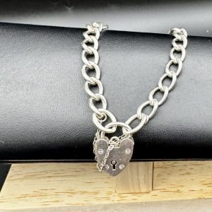 8” Sterling silver charm bracelet with heart locket