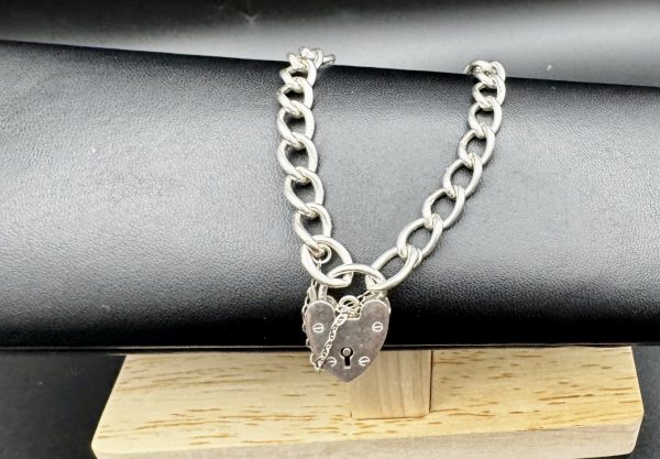 8” Sterling silver charm bracelet with heart locket