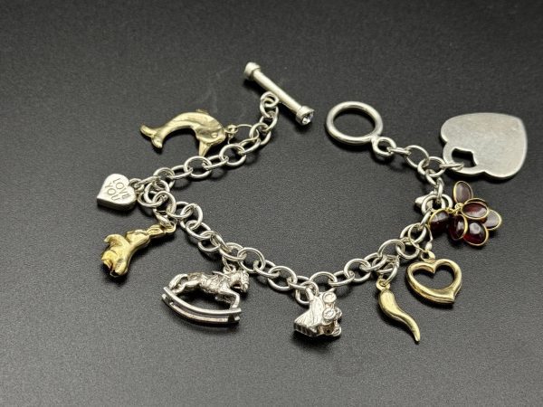 7” Charm bracelet with gold and silver charms - Image 4