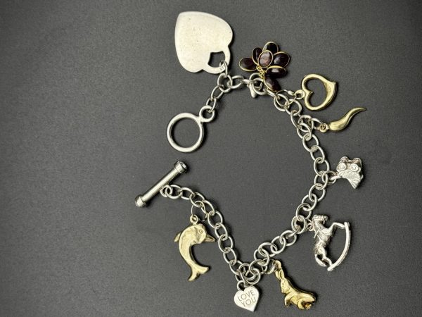 7” Charm bracelet with gold and silver charms - Image 3
