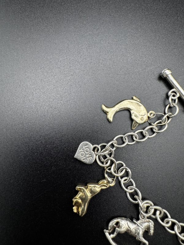 7” Charm bracelet with gold and silver charms - Image 2