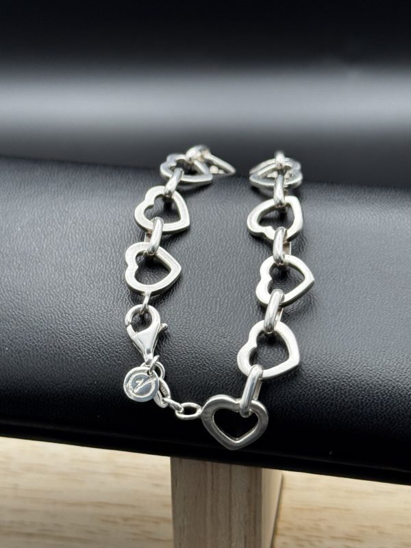 Sterling silver heart link bracelet.