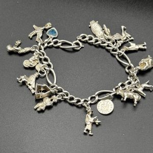 7” sterling silver charm bracelet with 16 charms