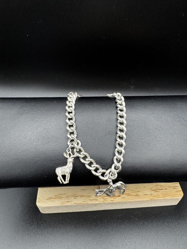 7” Sterling silver charm bracelet with horse and stag charm.