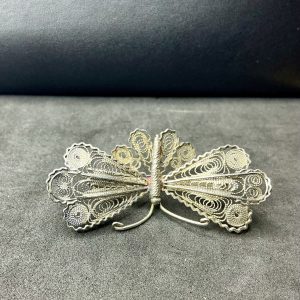 Silver filigree moth brooch