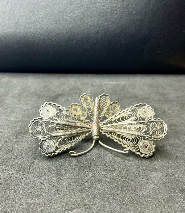 Silver filigree moth brooch