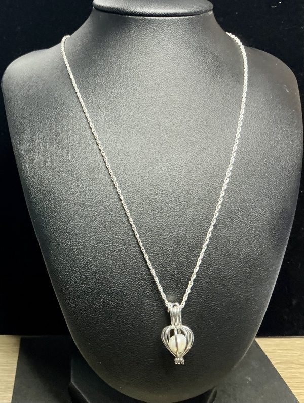 Sterling silver necklace with pearl cage pendant