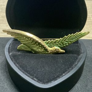 Gold tone bird brooch