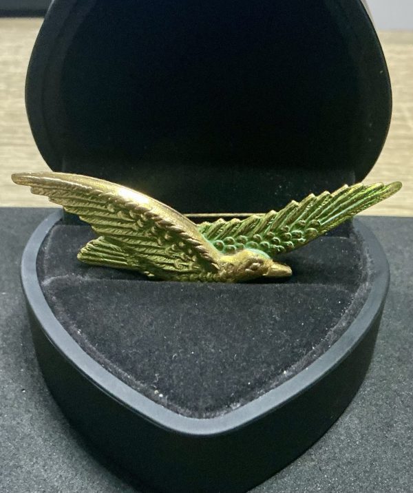 Gold tone bird brooch