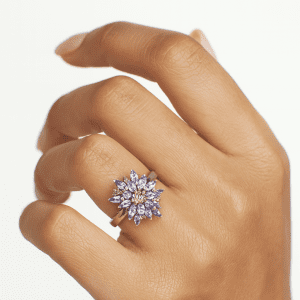 A striking sterling silver ring featuring a vivid cluster of marquise-cut tanzanite gemstones. The 2cm crown creates an unforgettable statement of elegance.