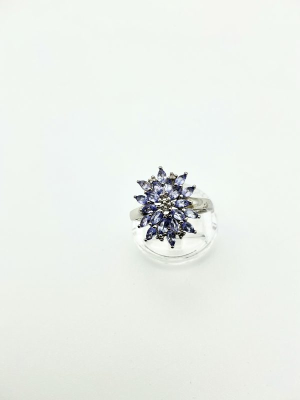 A striking sterling silver ring featuring a vivid cluster of marquise-cut tanzanite gemstones. The 2cm crown creates an unforgettable statement of elegance. - Image 9