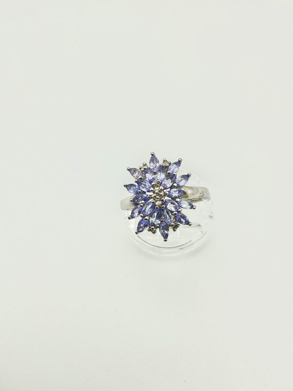 A striking sterling silver ring featuring a vivid cluster of marquise-cut tanzanite gemstones. The 2cm crown creates an unforgettable statement of elegance. - Image 7