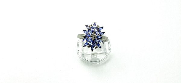 A striking sterling silver ring featuring a vivid cluster of marquise-cut tanzanite gemstones. The 2cm crown creates an unforgettable statement of elegance. - Image 6