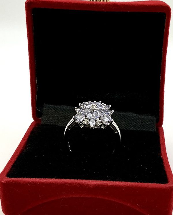 A striking sterling silver ring featuring a vivid cluster of marquise-cut tanzanite gemstones. The 2cm crown creates an unforgettable statement of elegance. - Image 5