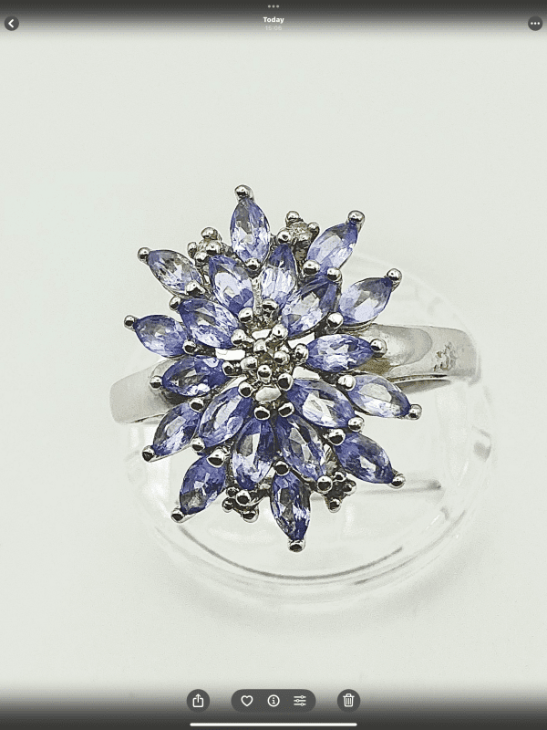 A striking sterling silver ring featuring a vivid cluster of marquise-cut tanzanite gemstones. The 2cm crown creates an unforgettable statement of elegance. - Image 4